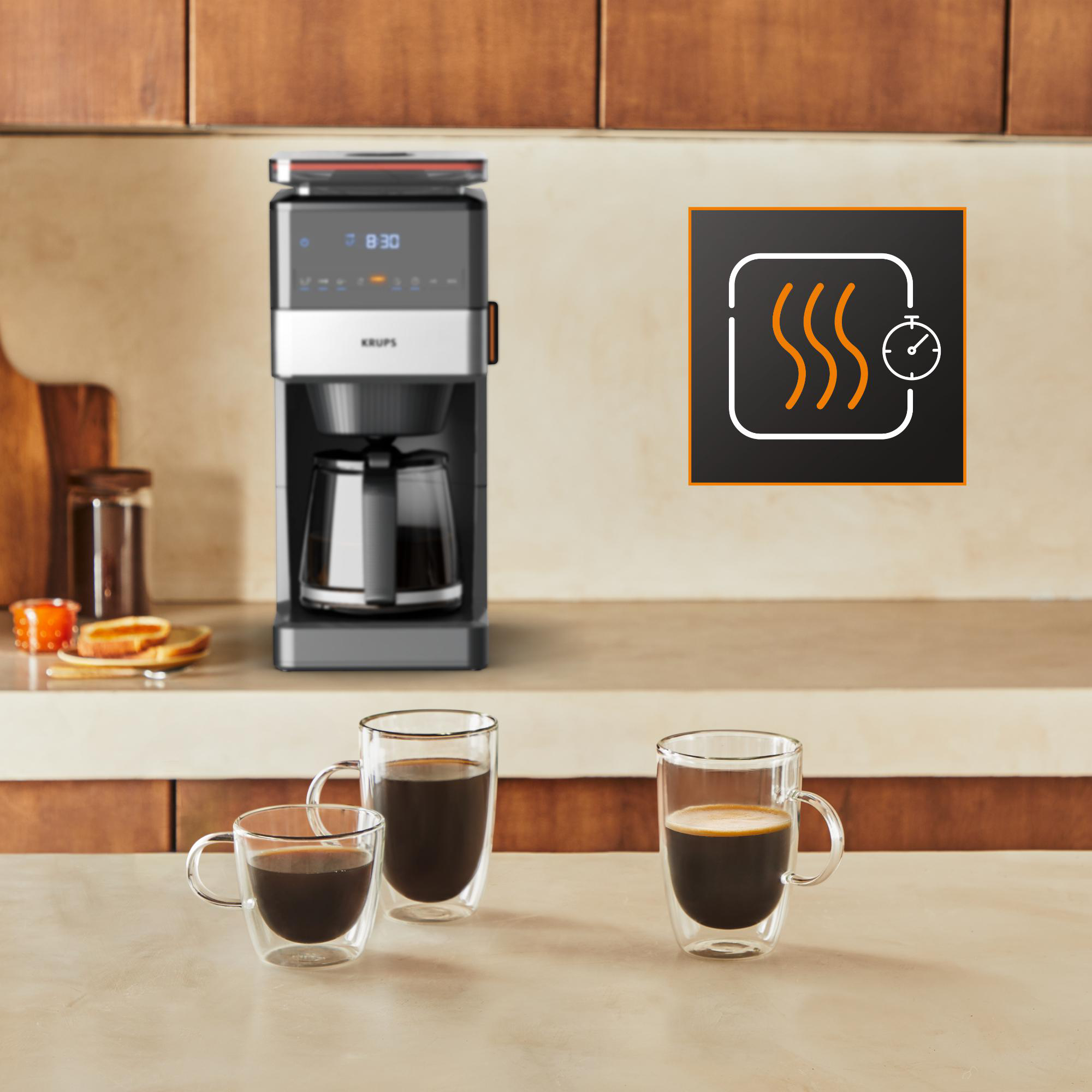 Kaffeemaschine, Kaffeetassen und Kaffee. Ein Zeit- und Wärmesymbol rechts.