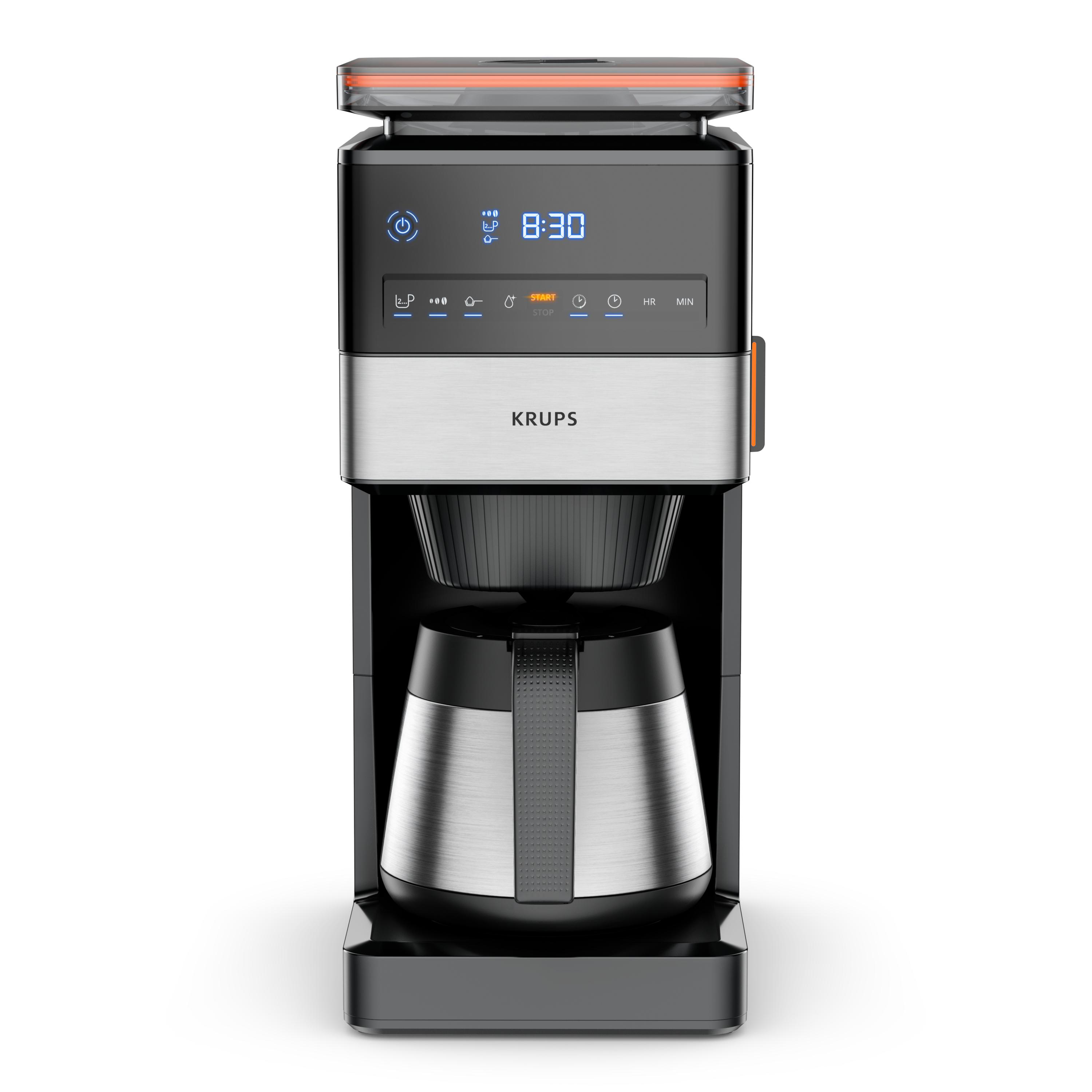 Schwarz-silberne Krups Kaffeemaschine. Digitalanzeige zeigt die Uhrzeit 8:30 und Bedienelemente darunter.
