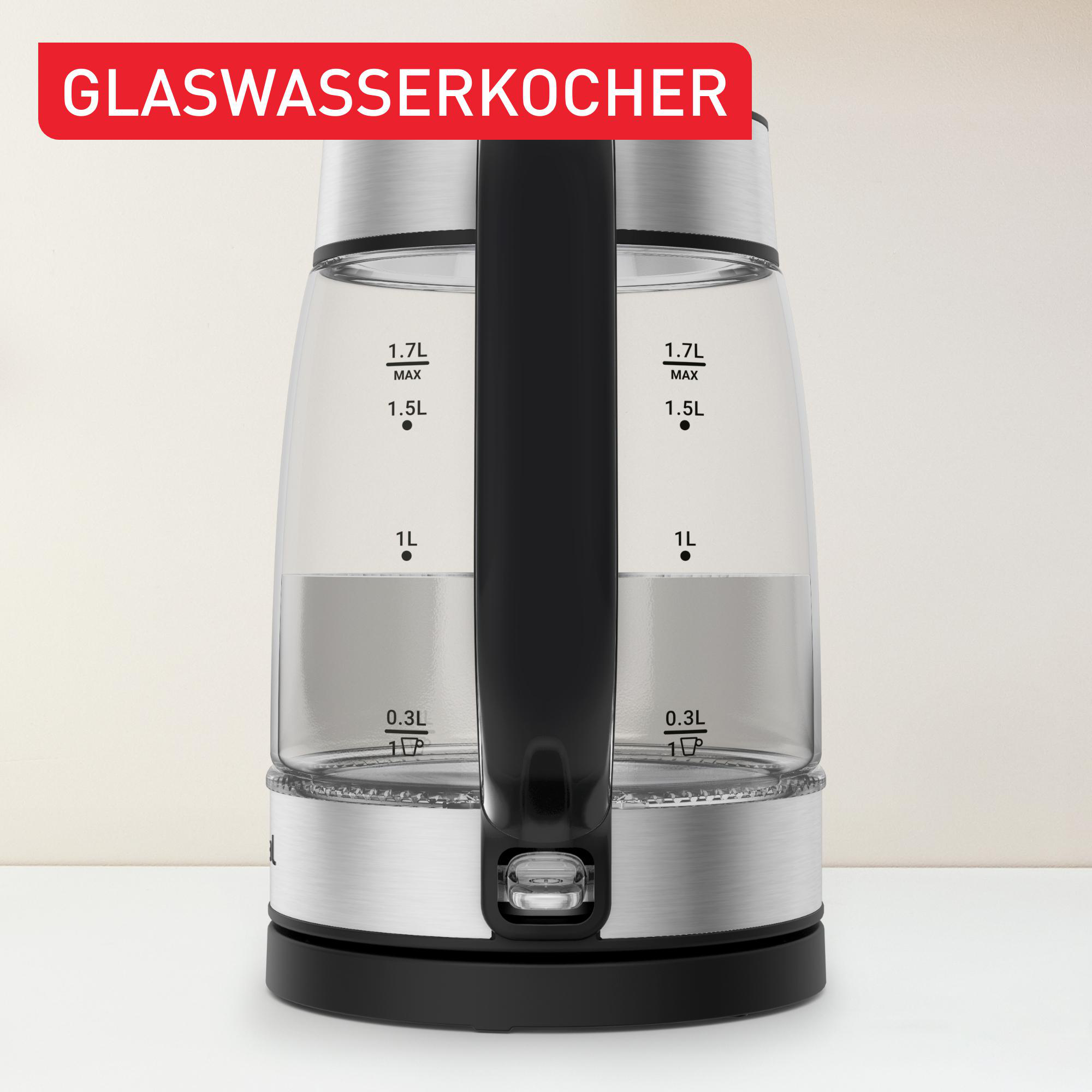 Ein Glas-Elektrokessel mit Wasserstandsanzeigen, schwarzem Griff und Metallbasis.