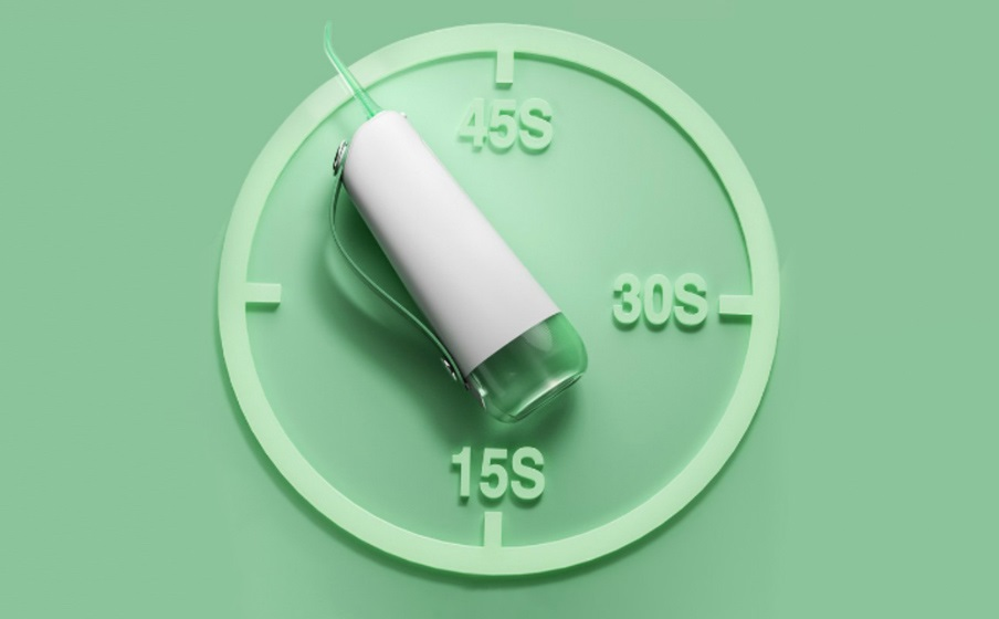 Irigator do zębów na zielonym tle, etykiety czasowe.