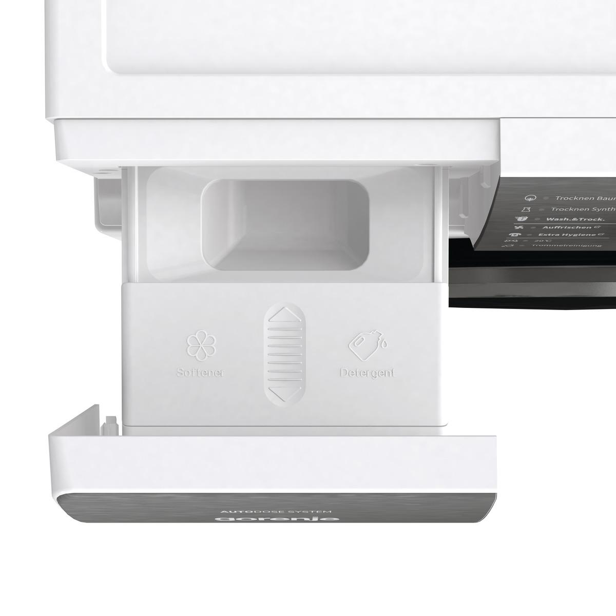 Weiße Waschmittel Schublade mit Fächern, schwarzes Panel, Nahaufnahme.