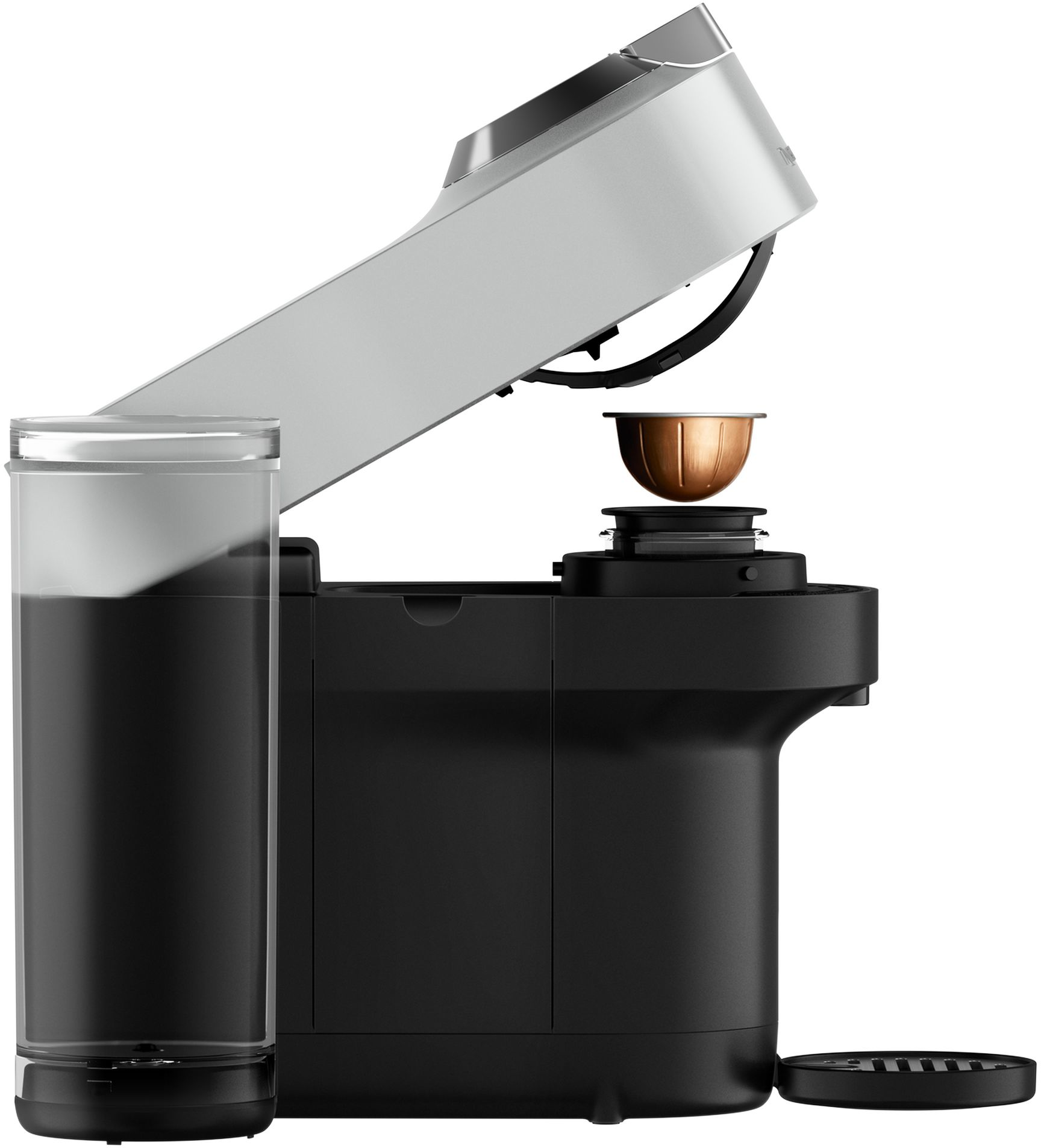 Macchina per caffè con parte superiore aperta, tazza e contenitore acqua.