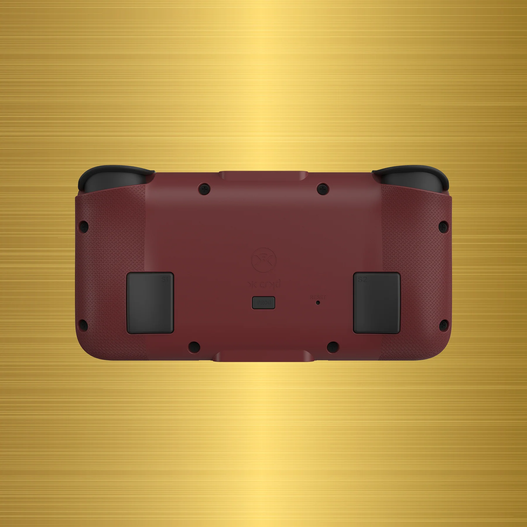 Retro di un dispositivo di gioco portatile bordeaux e nero su sfondo dorato.