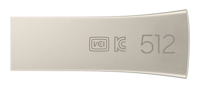 Srebrny pendrive USB. Dysk ma logo i wydrukowany numer 512.