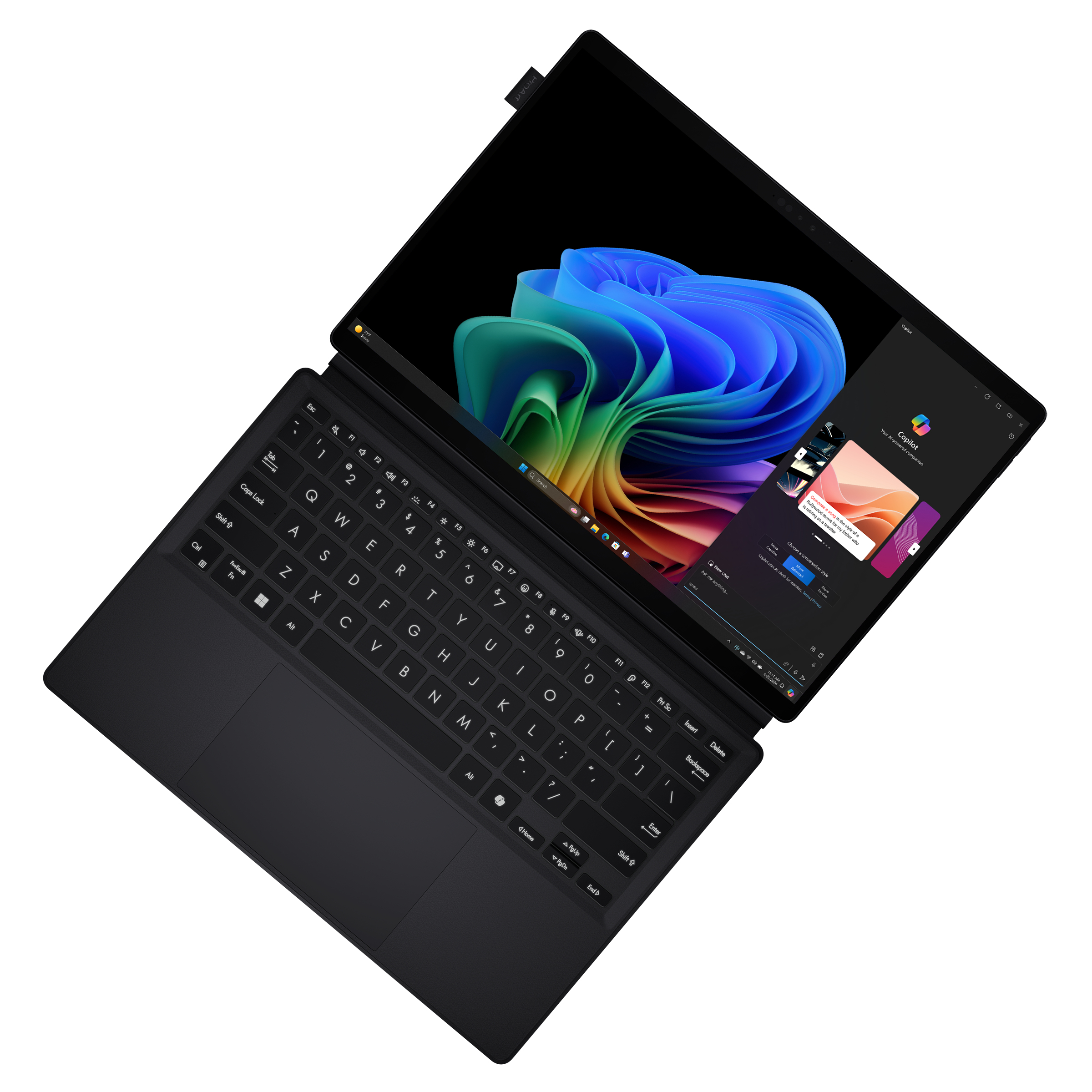Ordenador portátil negro con pantalla abierta mostrando una imagen abstracta colorida y un teclado.