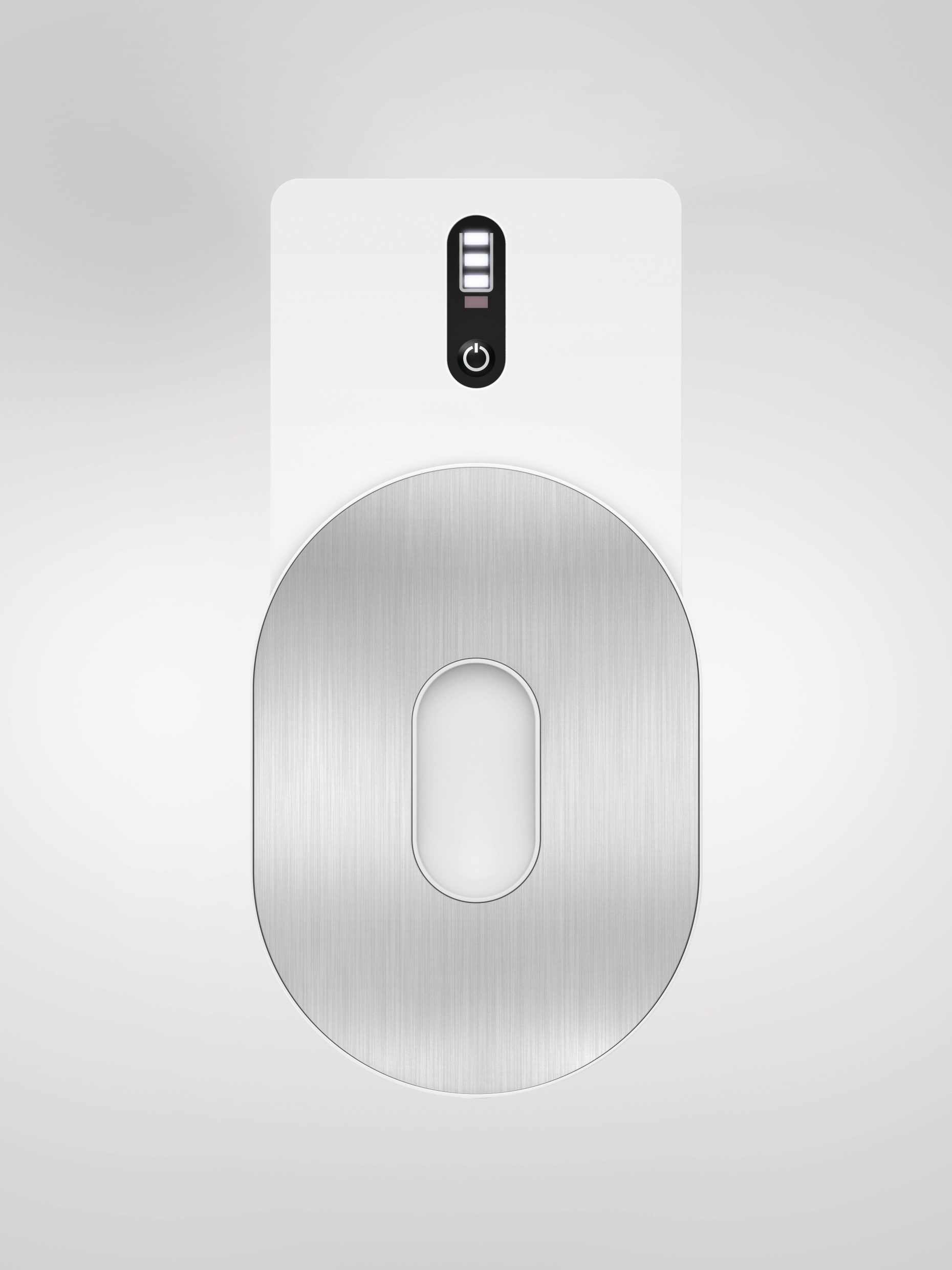 Ein Gerät, das wie eine Ladestation aussieht, mit einem silbernen Oval und einem Netzschalter.