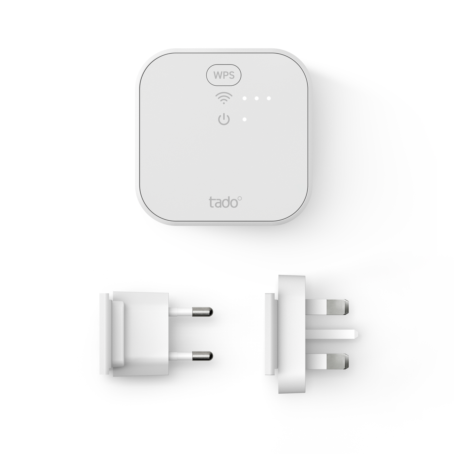 White Tado smart plug with plugs. Top view of the device and two different plugs.