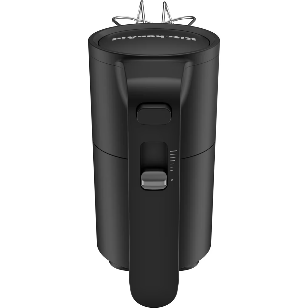 Batidora de mano KitchenAid negra. Muestra el mango, los controles de velocidad y la parte superior.