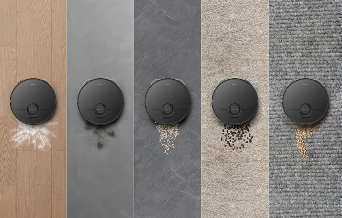 Robot sprzątający na różnych powierzchniach: drewno, szary, marmur, dywan i dywan teksturowany.