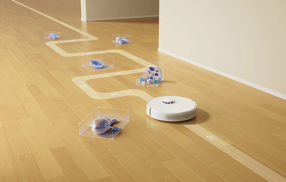 Robot sprzątający odkurza pokój. Ma ścieżkę oznaczoną pudełkami wokół obiektów.