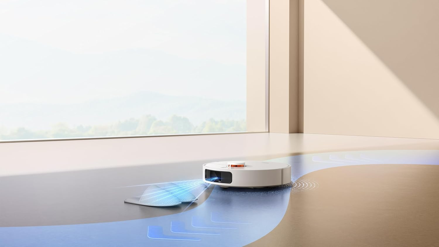 Un aspirateur robot blanc nettoie un sol. L'aspirateur a une face avant noire et se trouve près d'une fenêtre.