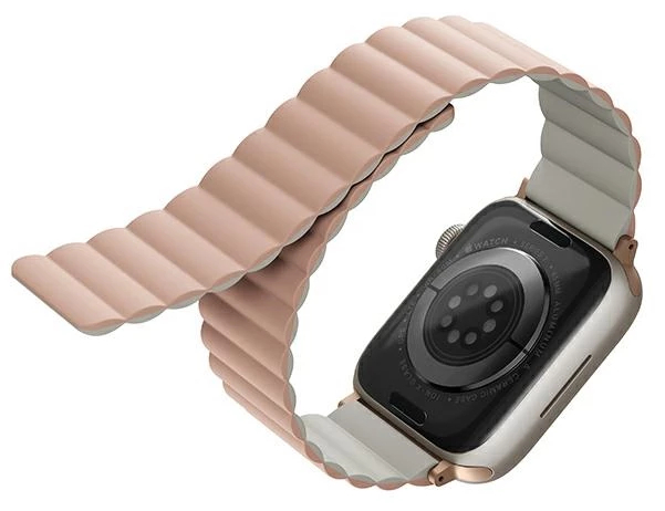 Różowy pasek Apple Watch o nowoczesnym designie, przymocowany do tarczy zegarka.