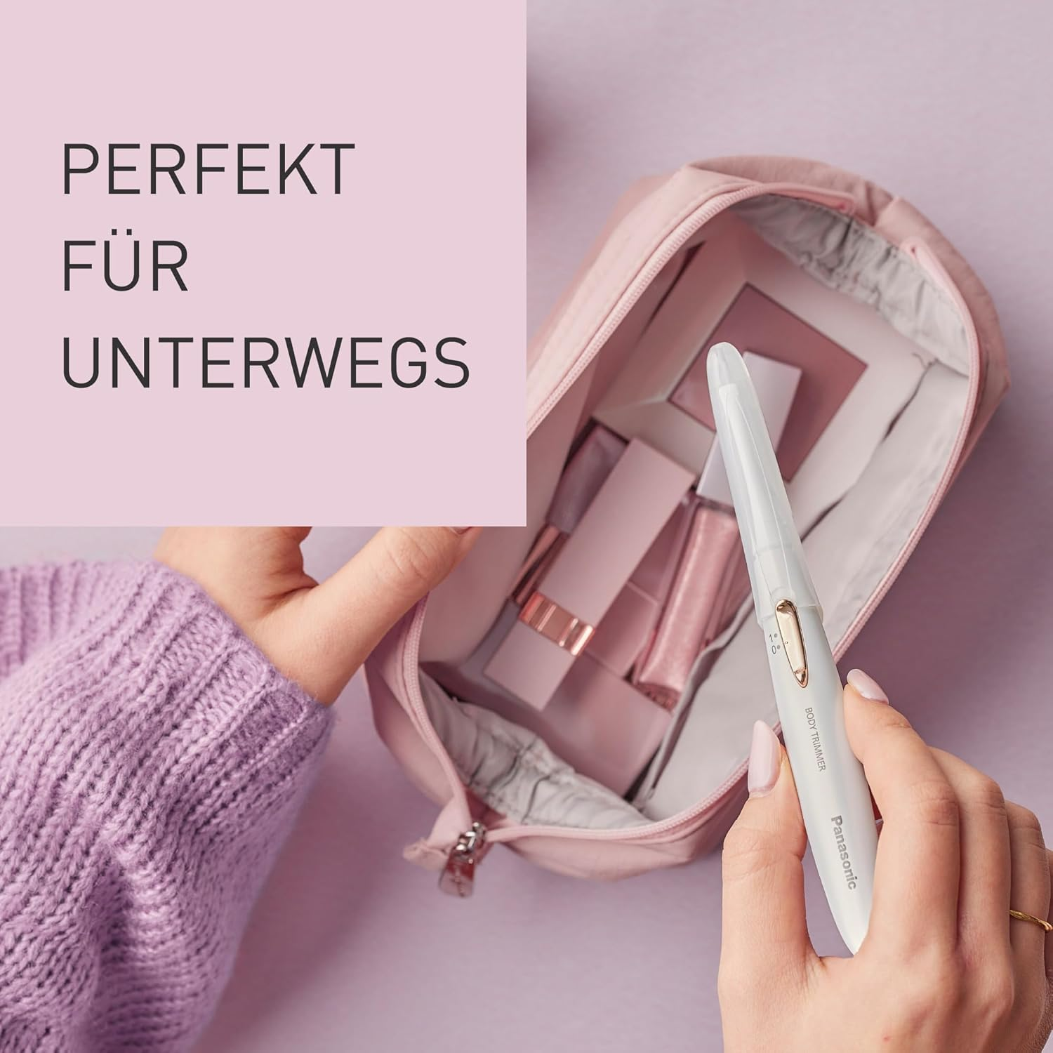Un sac rose, avec une tondeuse et d'autres produits de beauté.
