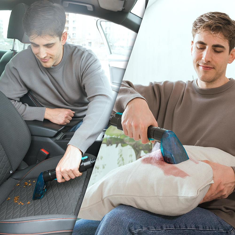 Hombre limpiando asiento y almohada con aspiradora de mano.