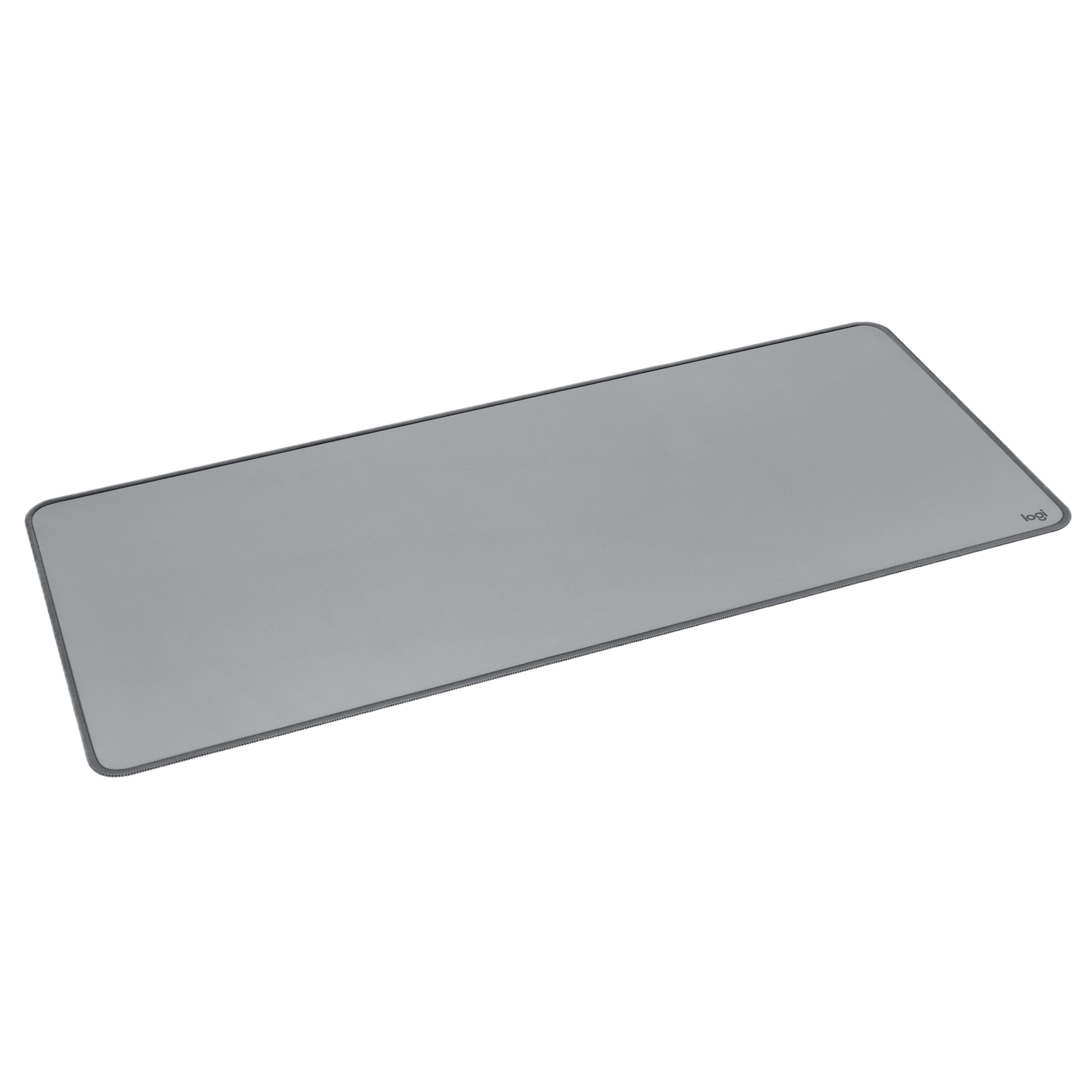 Tapis de souris gris sur fond noir. Il a une bordure grise et le logo Logitech.