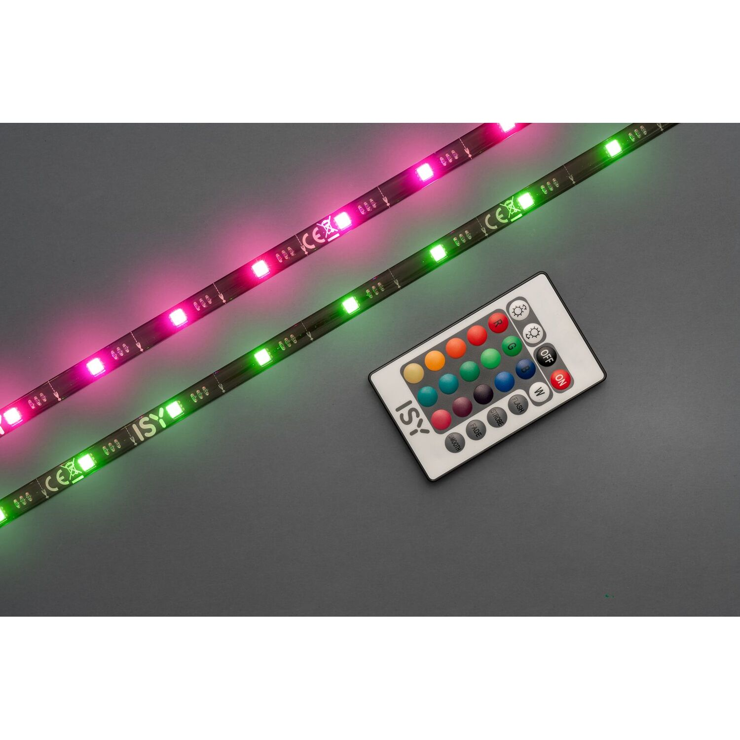 Two LED light strips, one pink and one green, with a remote control on a gray surface.