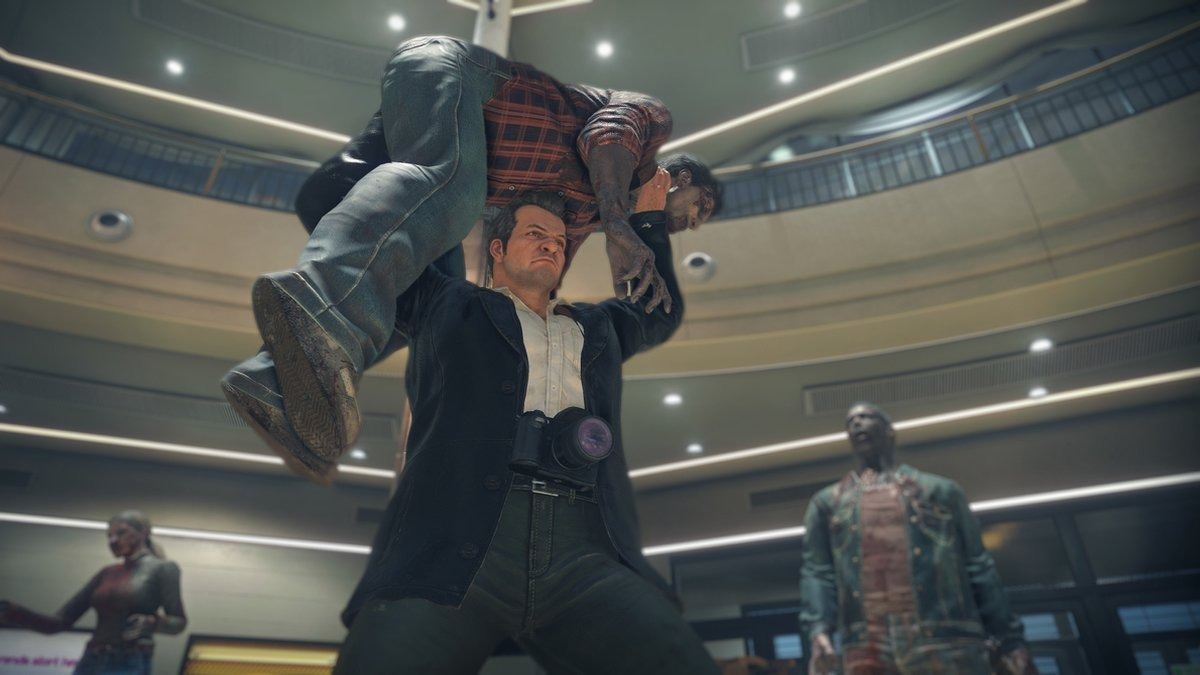 Man draagt een zombie op zijn schouders. Andere zombies en een winkelcentrum op de achtergrond.