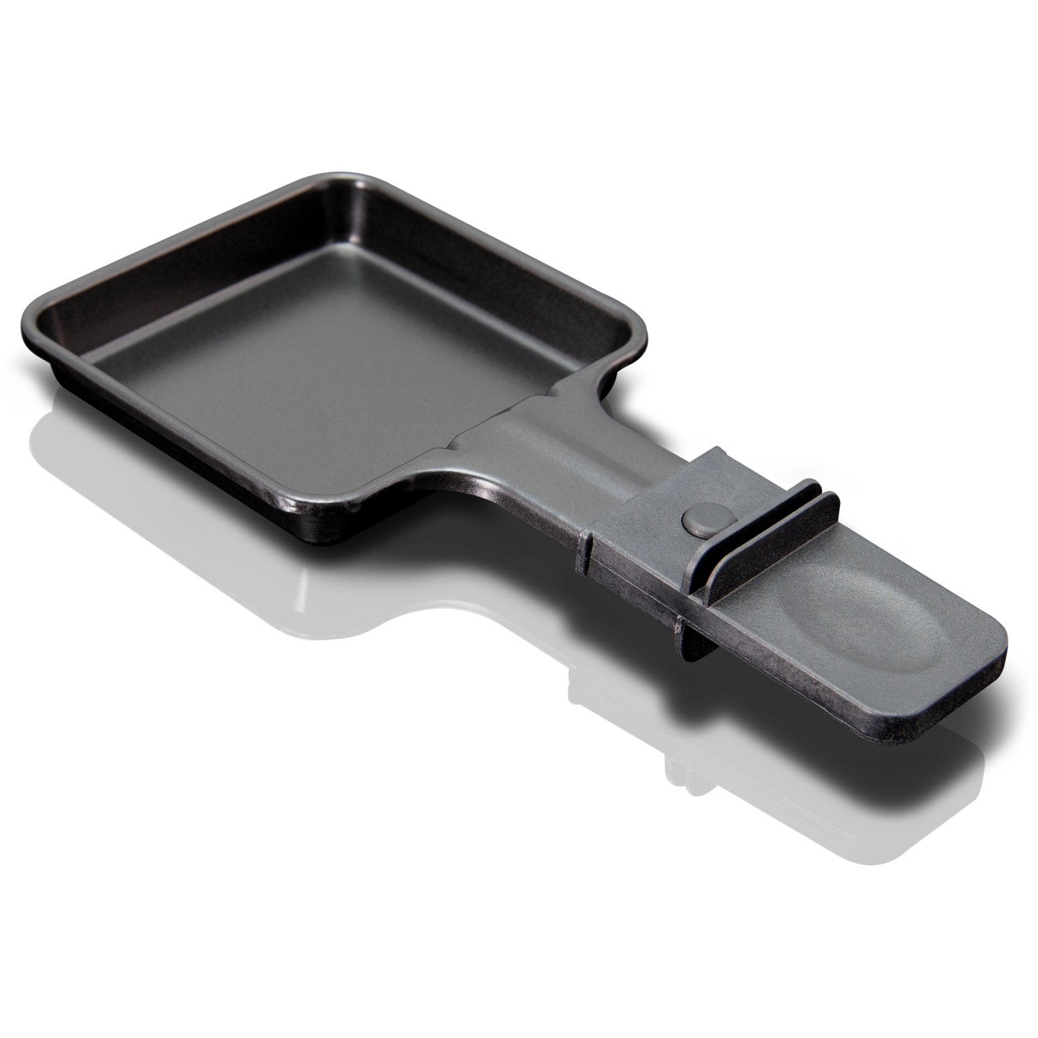 A black raclette grill pan on a glossy black surface. It has a handle and a tilting mechanism.