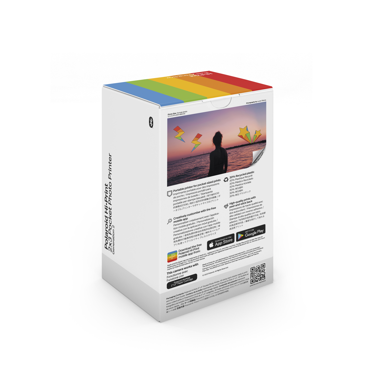 Boîte d'imprimante Polaroid avec dessus arc-en-ciel, infos produit et images. Blanc avec détails colorés.