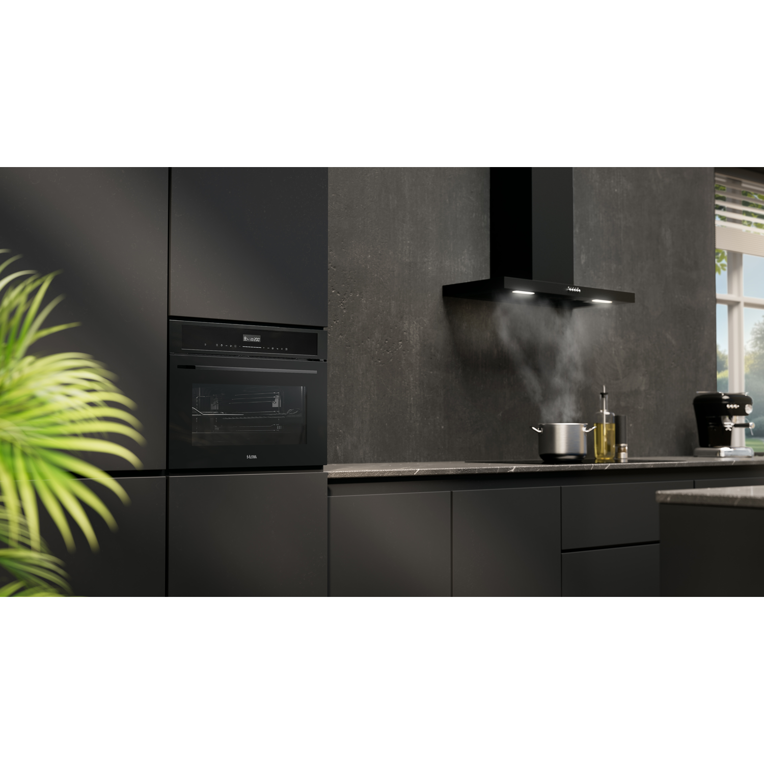 Black kitchen with oven and hood.