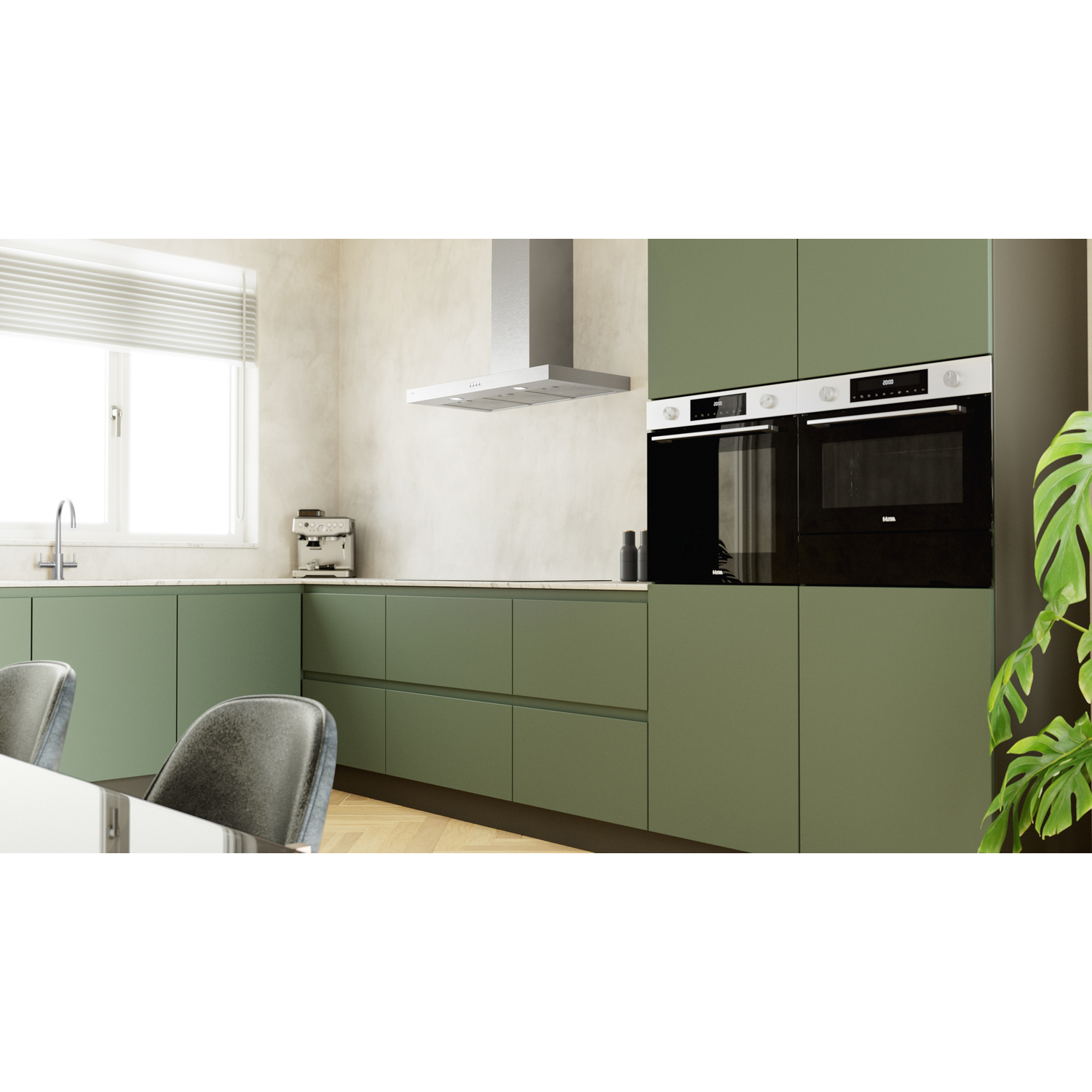 Modern kitchen with green cabinets, white countertops, and stainless steel appliances.
