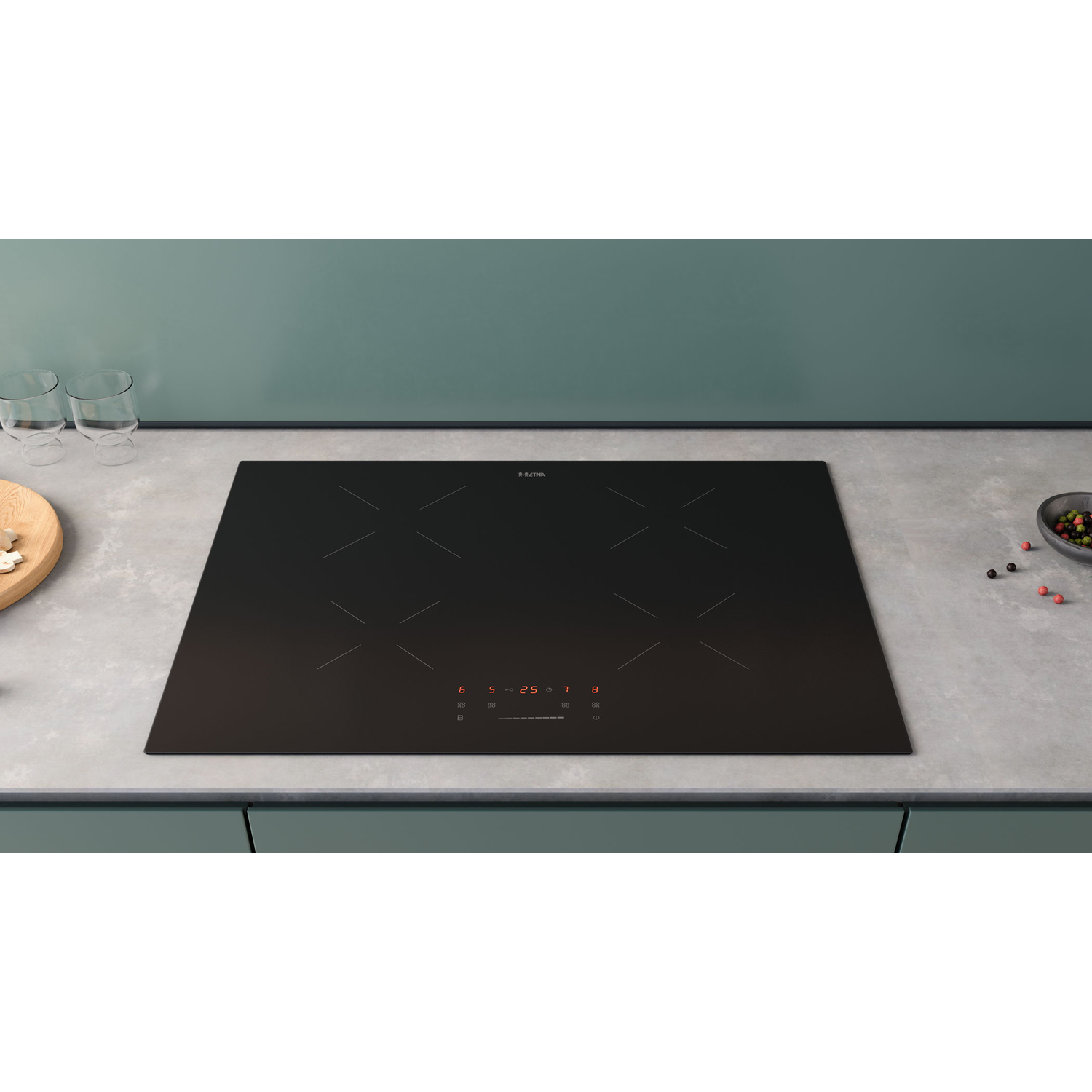Black induction cooktop on a countertop, with four burners and digital display.