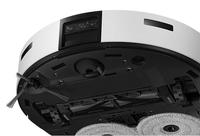 Widok od spodu białego robota sprzątającego ze szczotkami i nakładkami czyszczącymi.