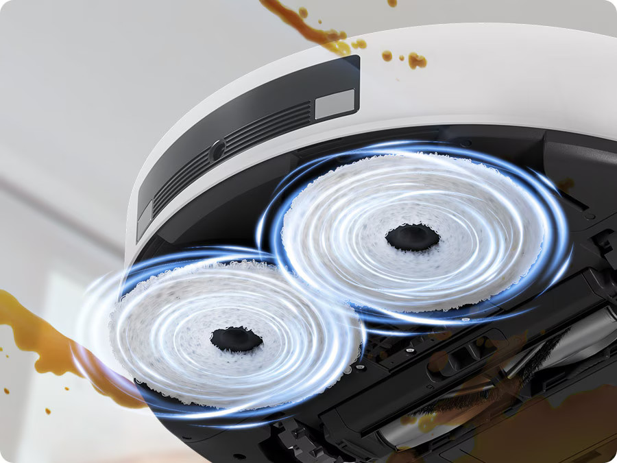 Odkurzacz robot, widok od spodu. Widoczne okrągłe szczotki i system czyszczenia.