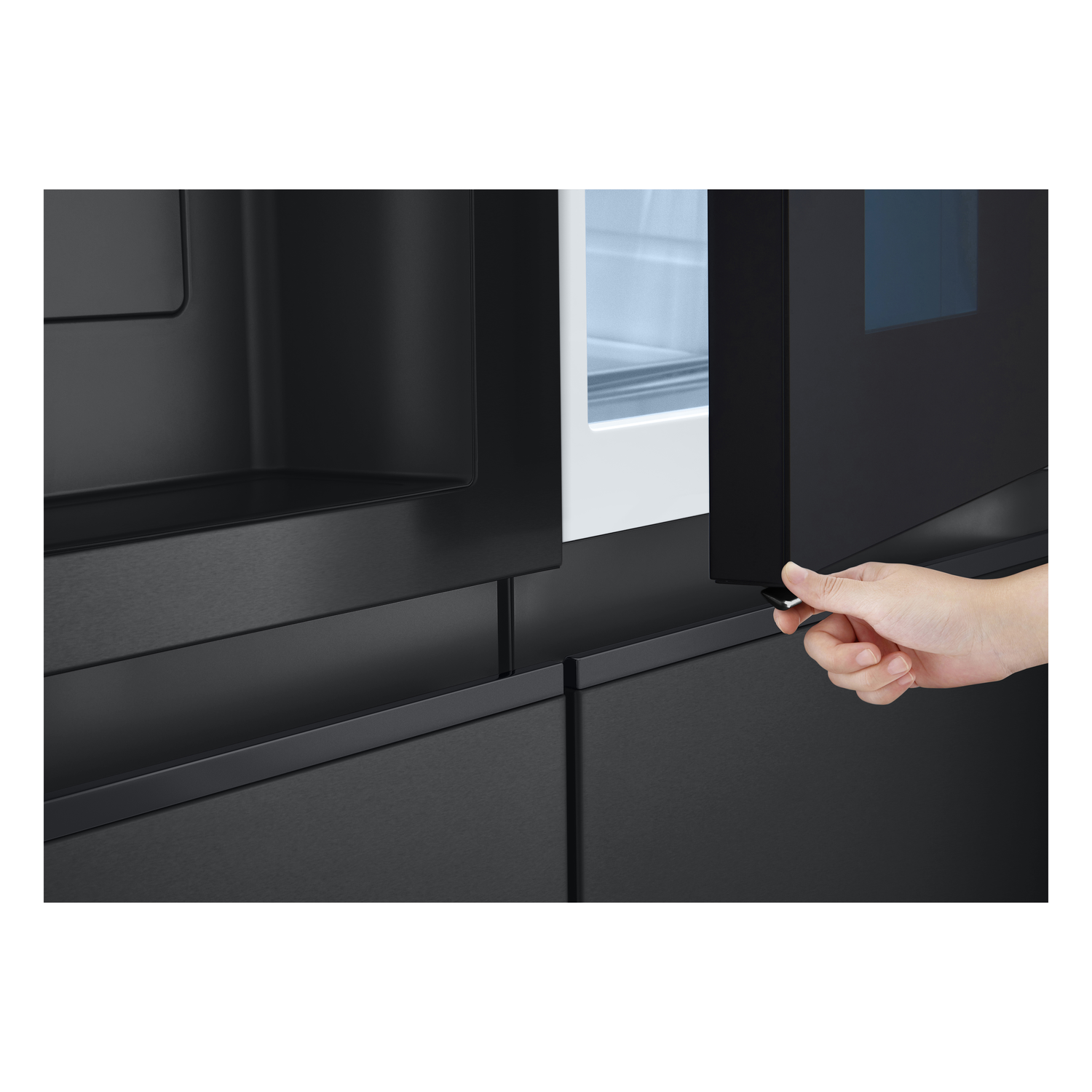 Hand opening a black refrigerator door with a glass panel.
