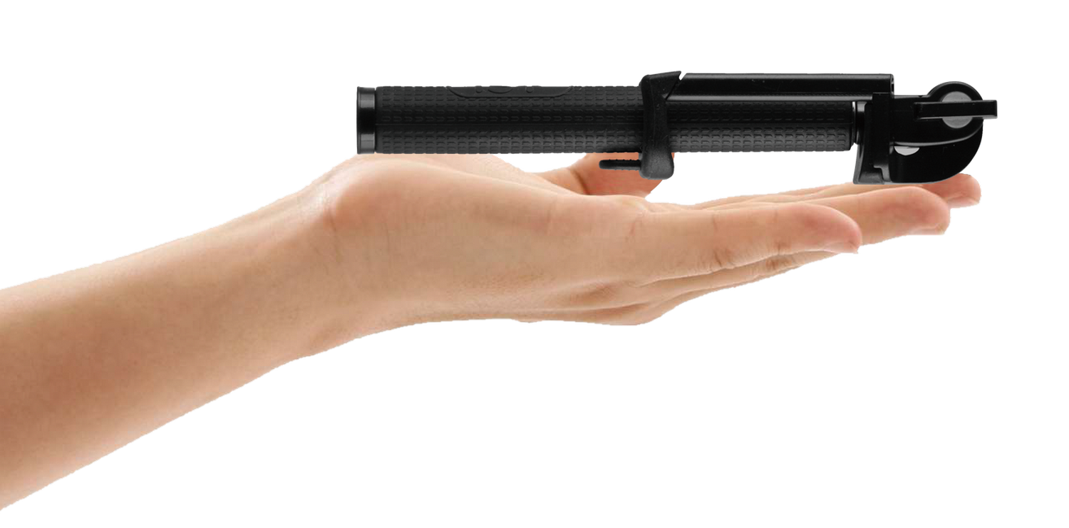 Dispositivo negro sostenido en una mano.