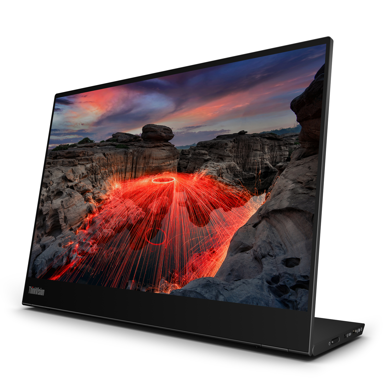 Een laptopscherm met een kleurrijke scène van vuur en rotsen, iets schuin.