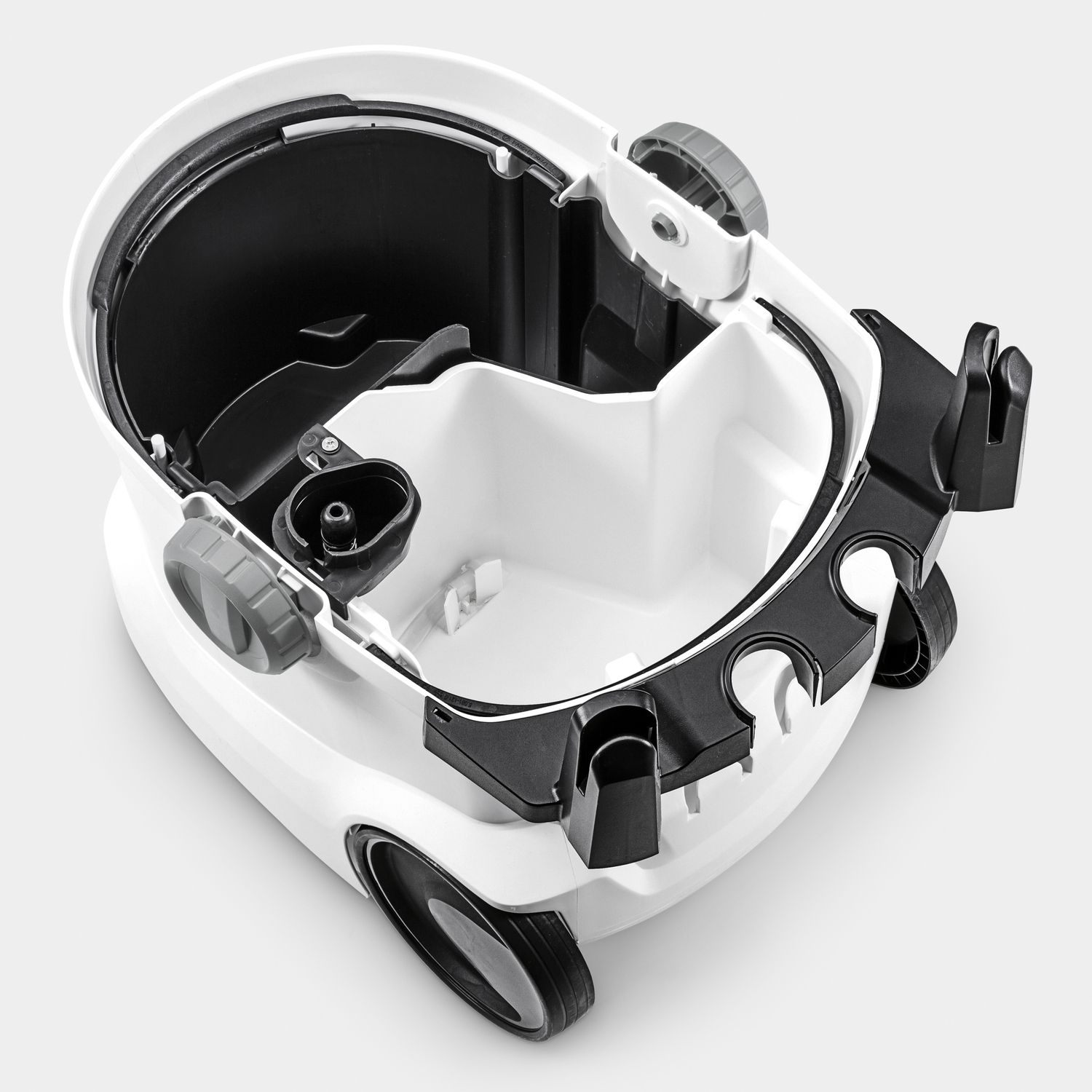 Open white vacuum cleaner with black details and wheels, empty inside.