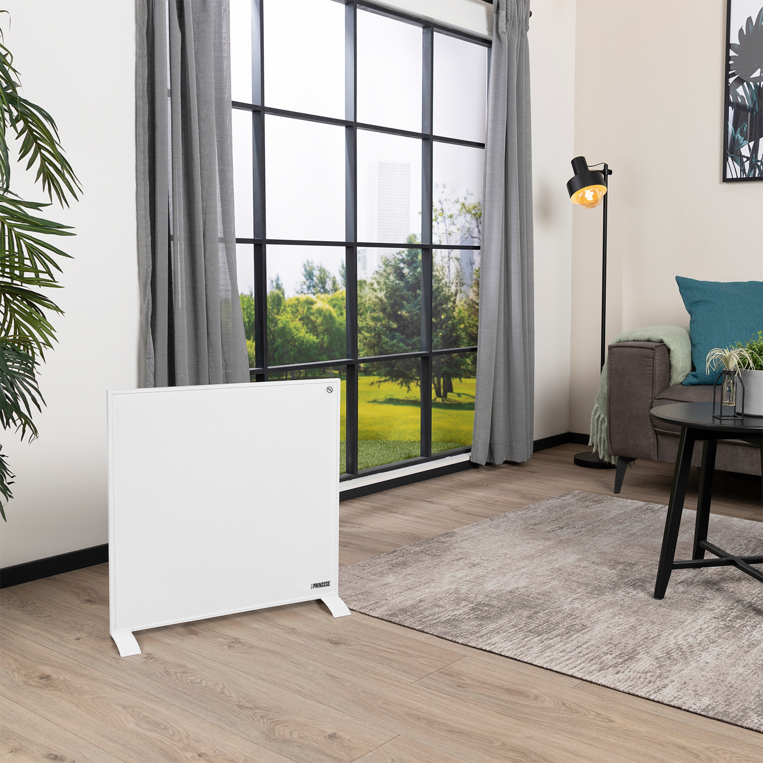 Un salon avec un radiateur blanc, une fenêtre et des meubles.