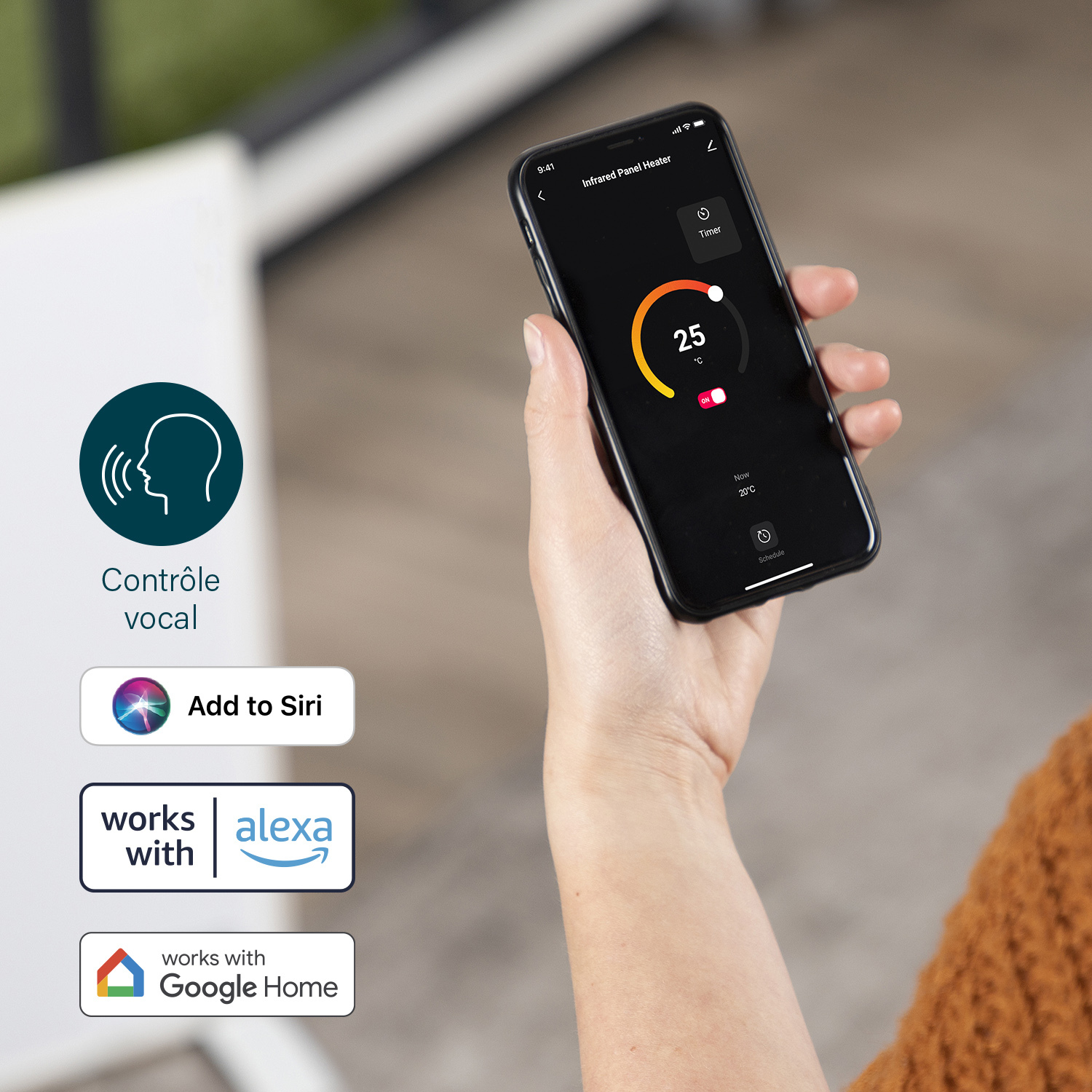 Une main tenant un smartphone affichant l'interface de contrôle de la température d'un appareil de chauffage.