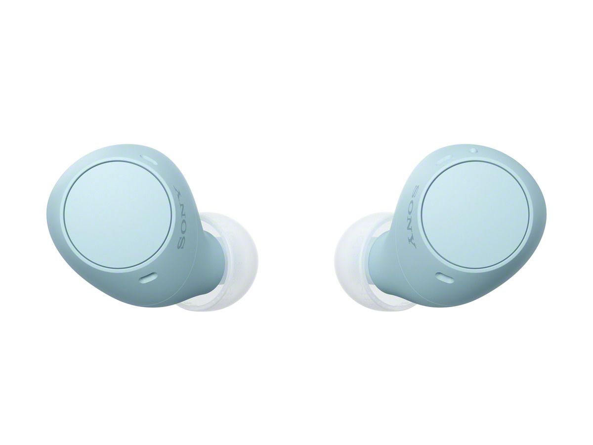 Dos auriculares azul claro sobre fondo blanco, direcciones opuestas.
