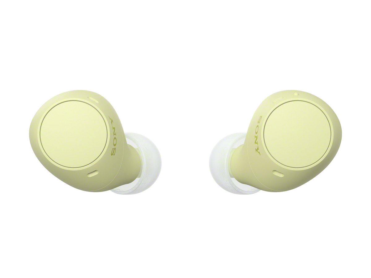 Auriculares inalámbricos amarillos, mostrando la forma del auricular.