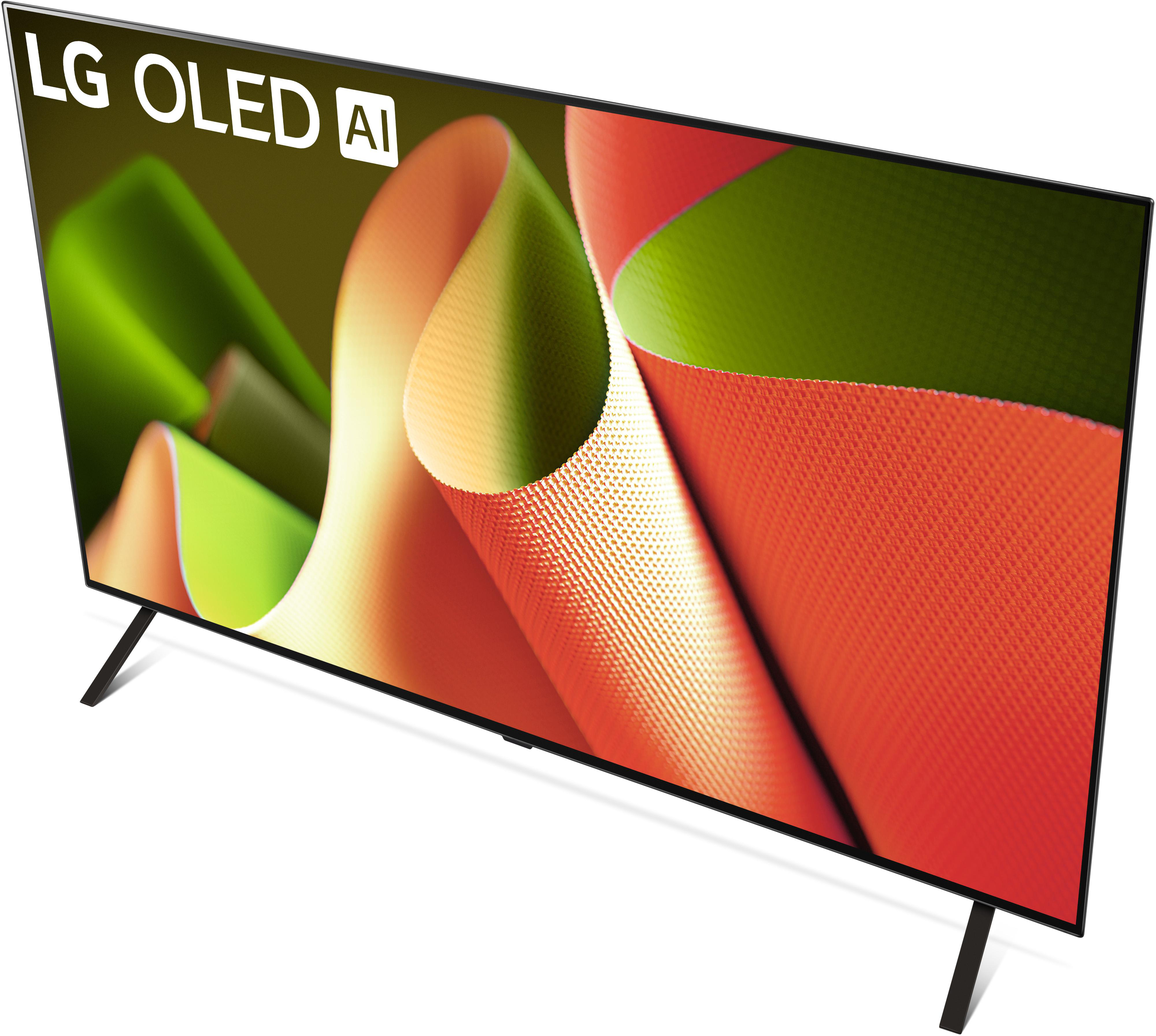 LG OLED AI TV mit farbenfrohem, abstrakten Design auf dem Bildschirm, schwarze Beine.