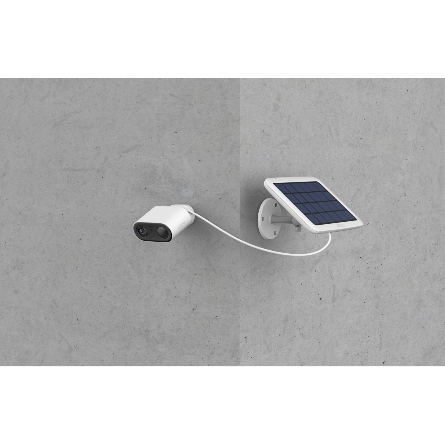A security camera and solar panel attached to a wall.