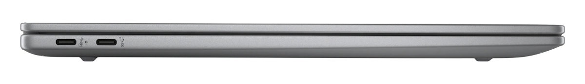 Widok z boku zamkniętego srebrnego laptopa z dwoma portami USB-C i nóżkami.