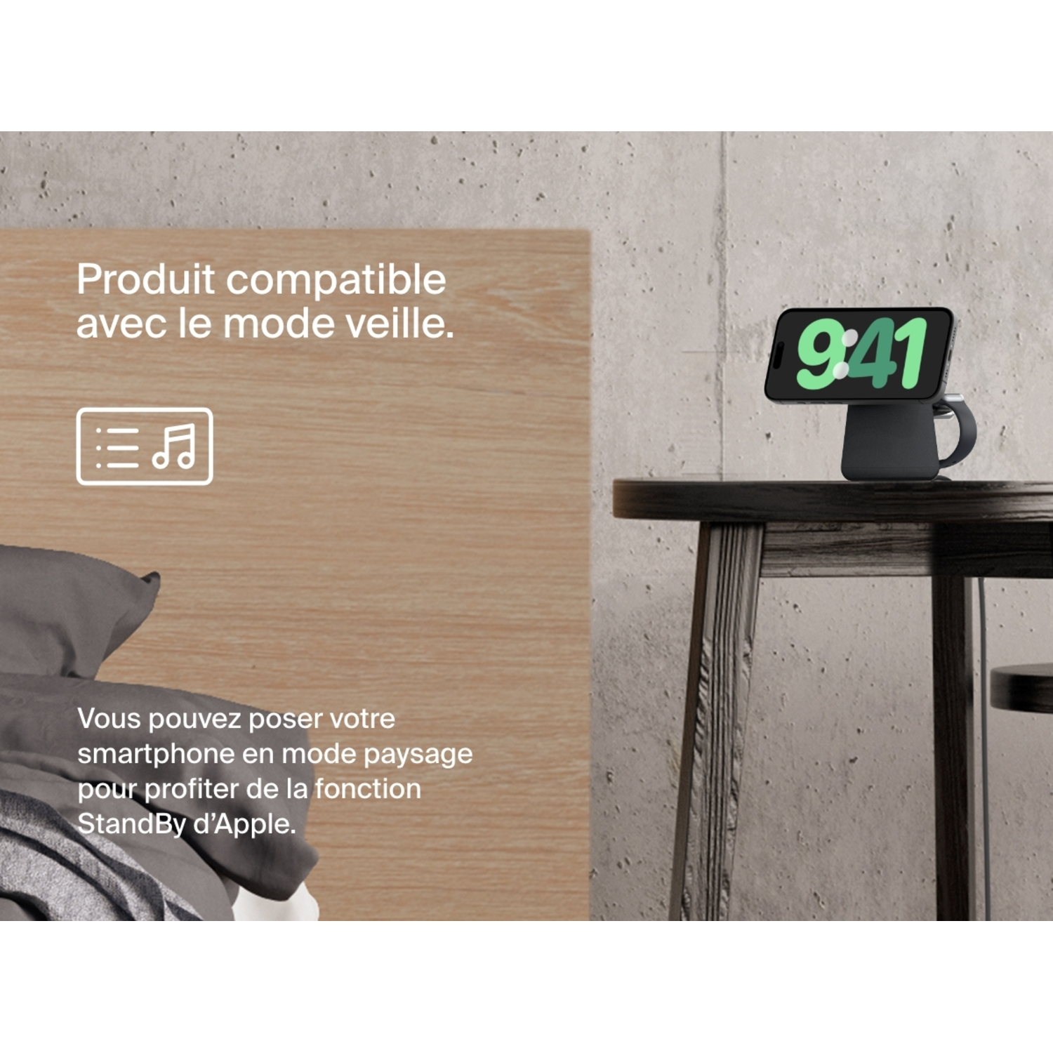 Smartphone sur un socle de charge, avec l'heure 9h41. Dans une chambre avec un lit.