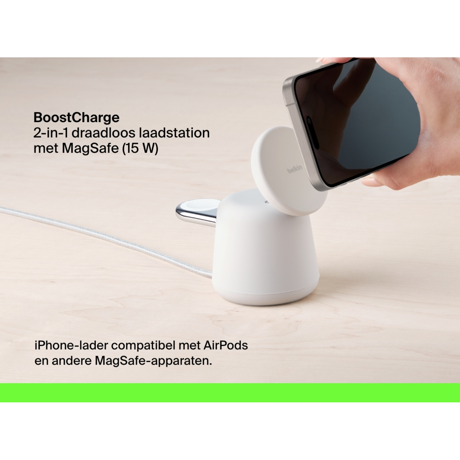 A white wireless charger with a phone attached, placed on a wooden surface.