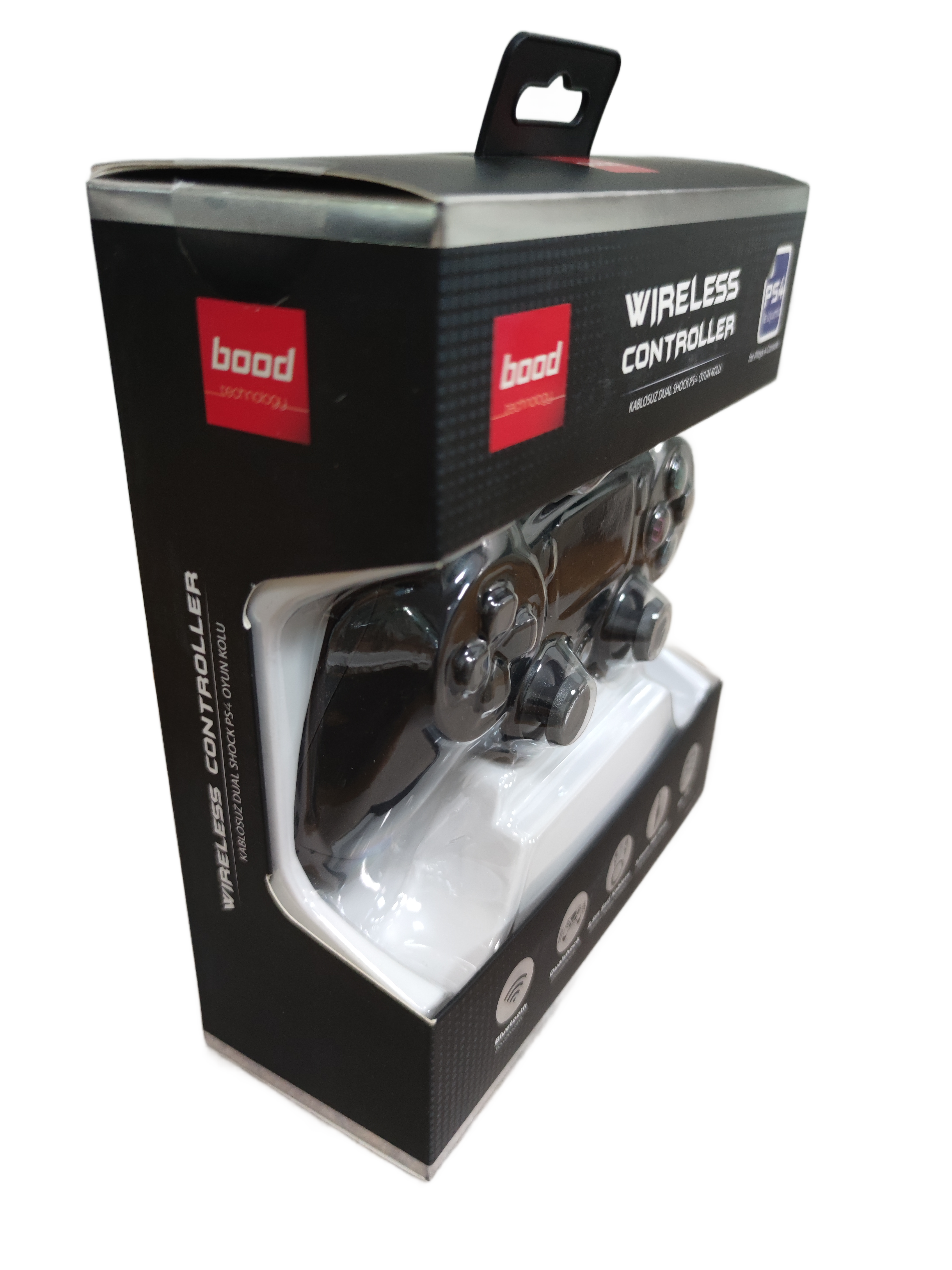 Siyah bir kablosuz kontrolcü, yandan görünen siyah ve beyaz bir kutuda.