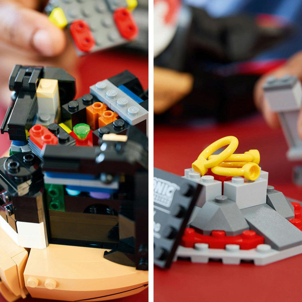 Nahaufnahme einer Lego-Konstruktion. Eine Seite mit schwarzen Lego-Steinen, die andere mit gelben.
