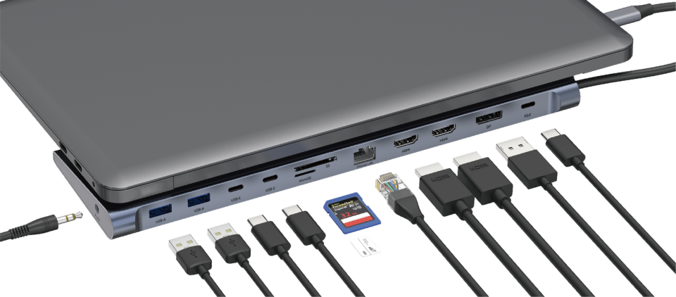 Ordenador portátil conectado a una estación de acoplamiento con múltiples cables, incluyendo USB, HDMI y Ethernet.