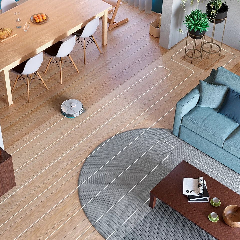 Salon z robotem sprzątającym czyszczącym drewnianą podłogę, pokazującym jego ścieżkę.