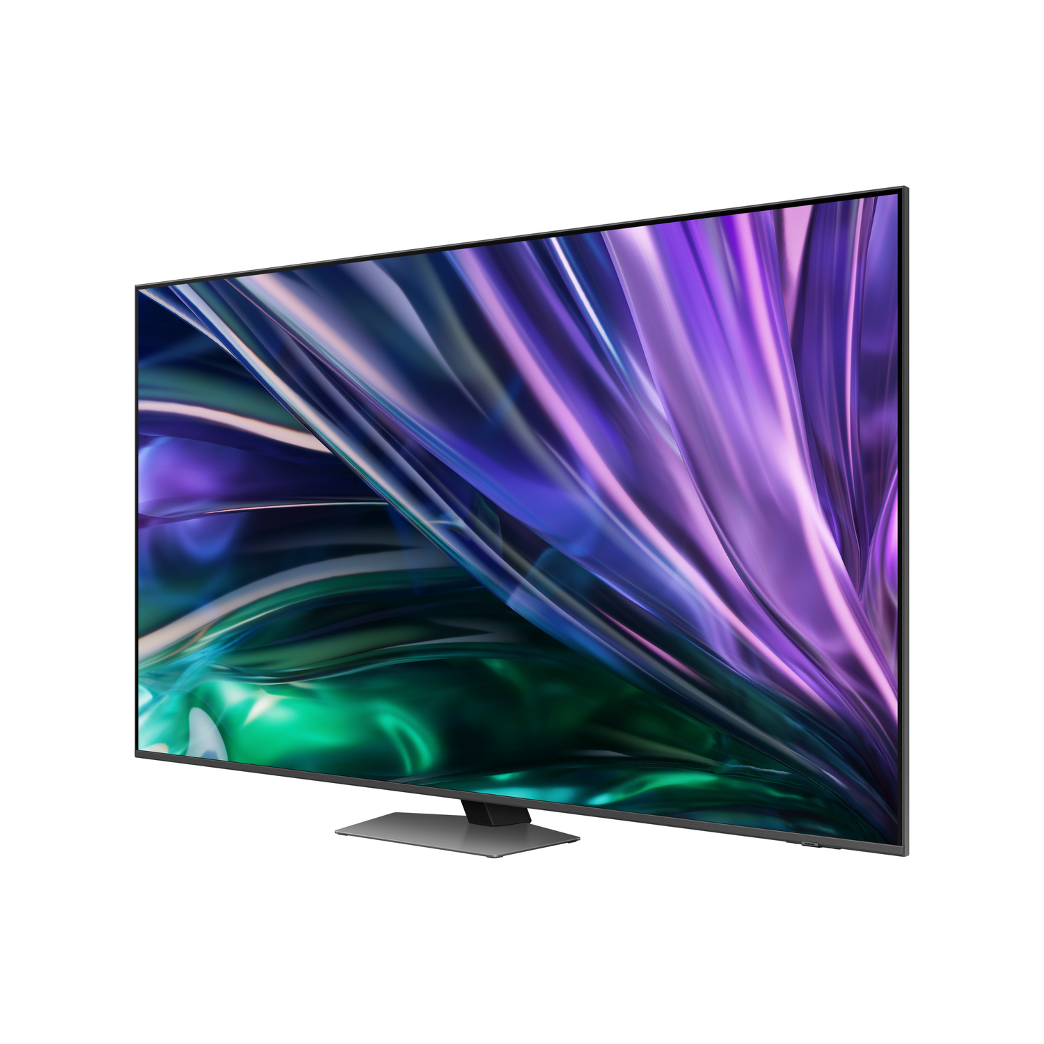 Grand téléviseur noir avec un écran coloré, posé sur un support sombre.