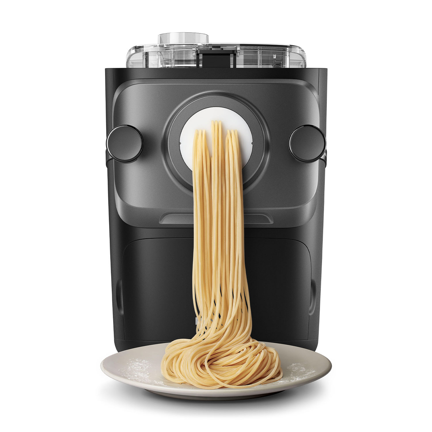 Macchina per la pasta con spaghetti che escono su un piatto bianco.
