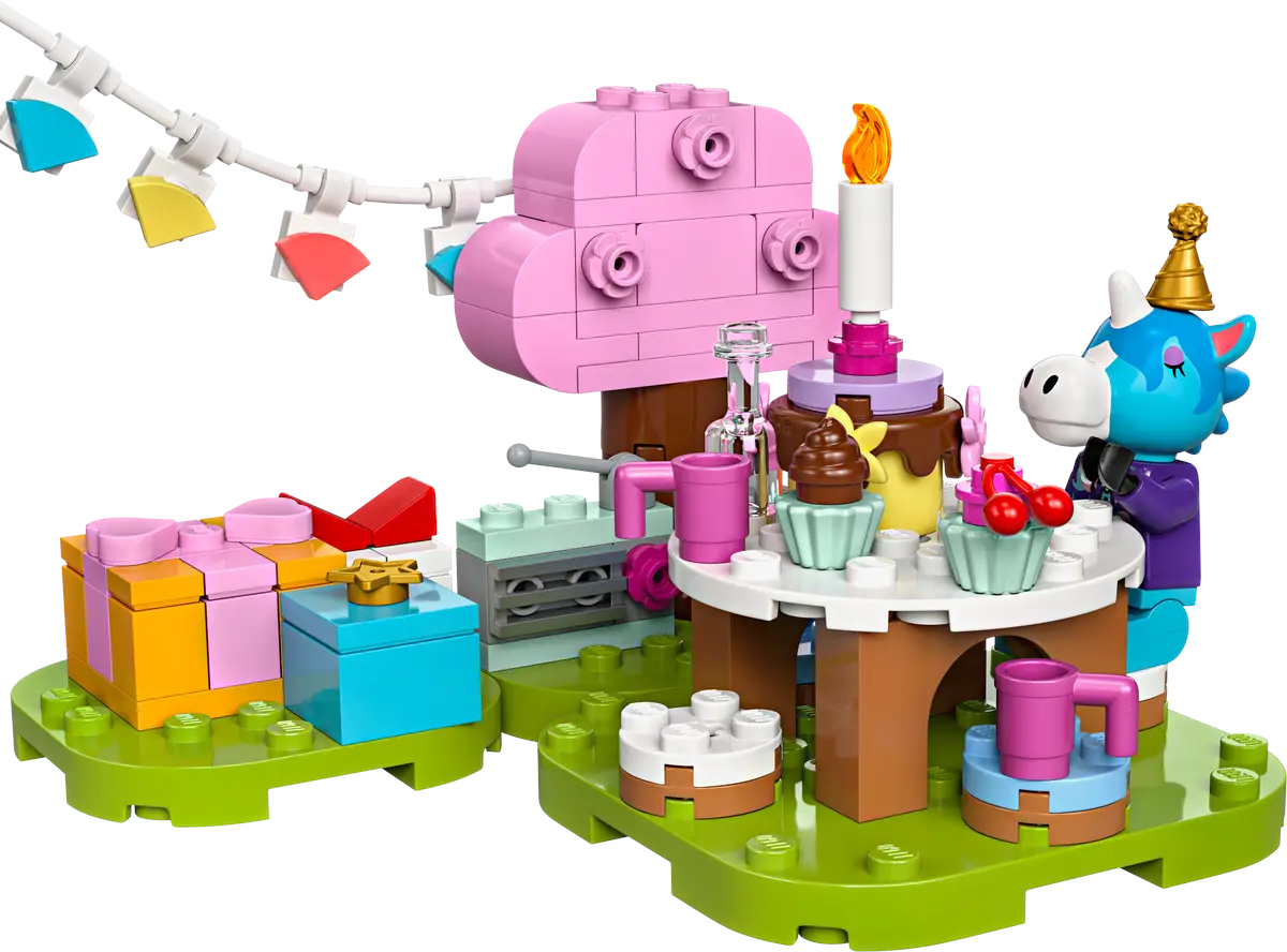 Zestaw urodzinowy LEGO z ciastem, prezentami, figurką jednorożca i innymi kolorowymi elementami na zielonej podstawie.