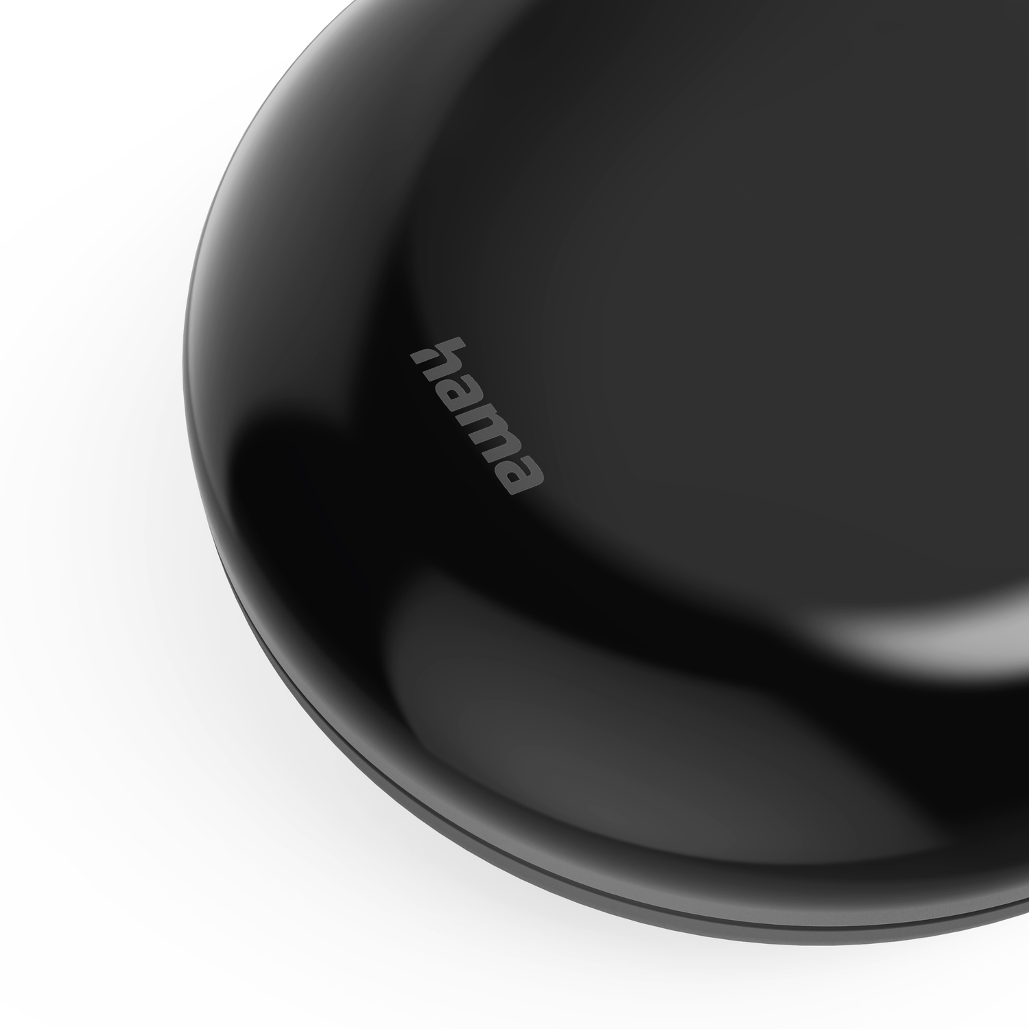 Black circular object with Hama branding.