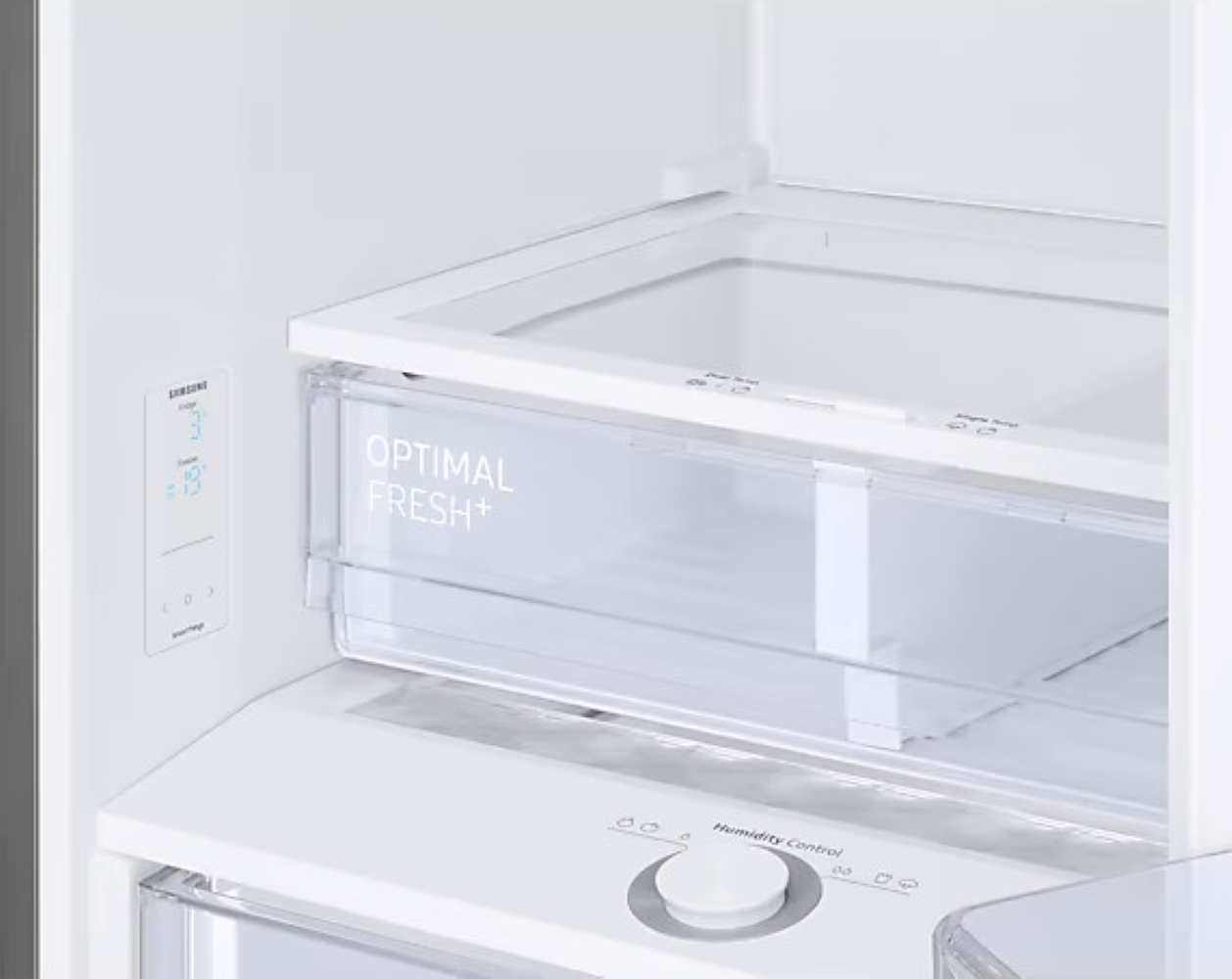 Widok wnętrza białej lodówki z przezroczystą szufladą z napisem 'Optimal Fresh+'.